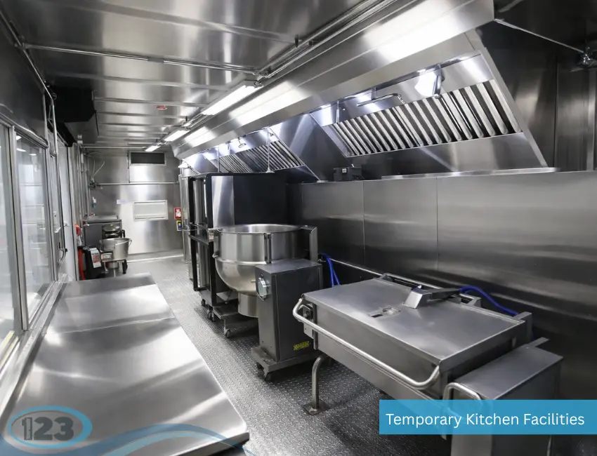 Event kitchen trailer showing commercial cooking appliances and a fully equipped mobile food service area.
